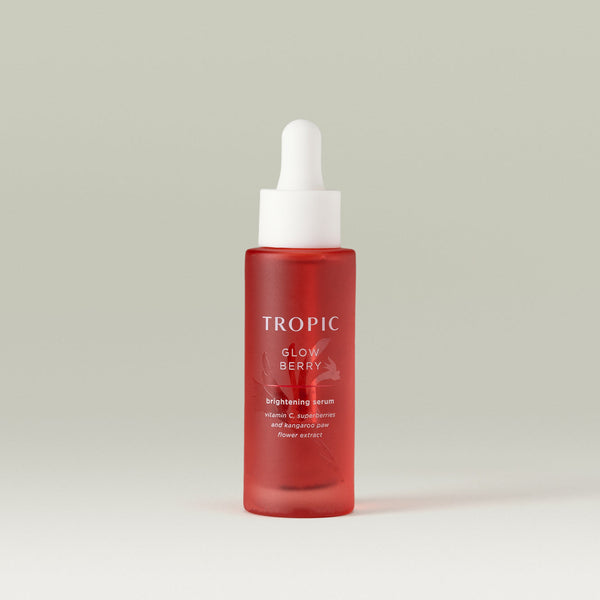 Tropic Glow Berry brightening serum. Vitamin C, superberries and kangaroo paw flower extract. Deep red glass bottle with embossed floral design behind white text.